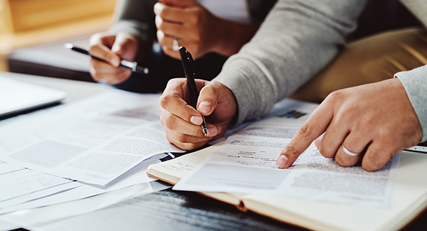 man signing paperwork