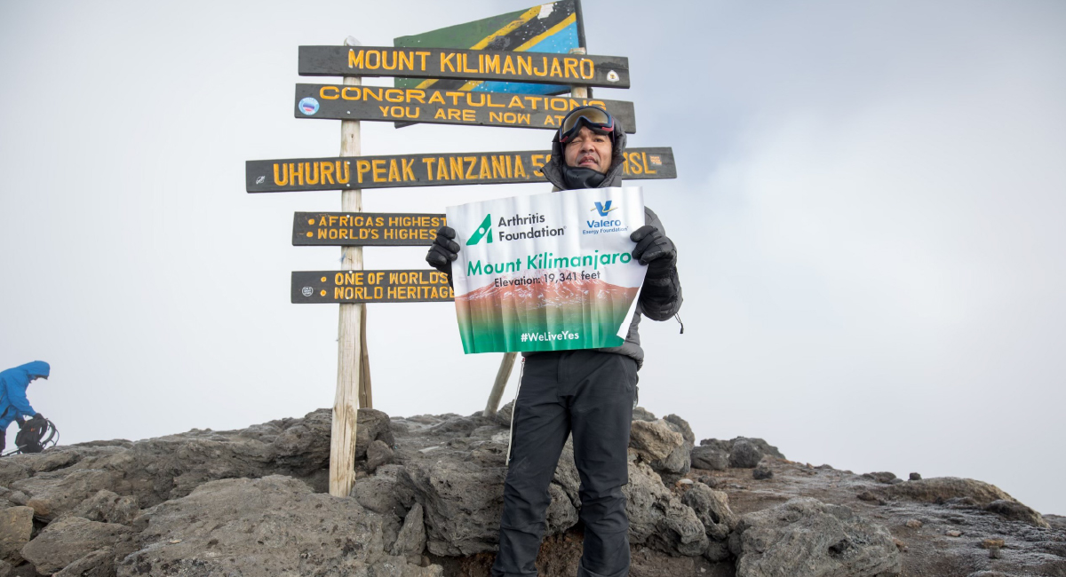 Sachi Ary on top of Mount Kilimanjaro