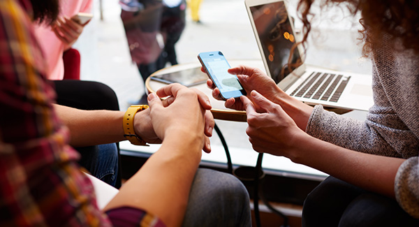 group of people on phone and tablets
