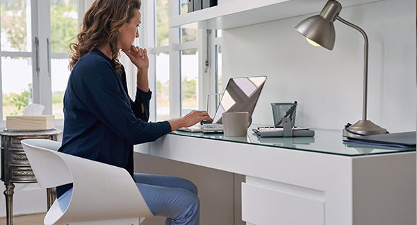 woman at a desk with her laptop