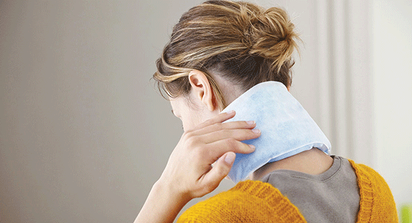 Woman with ice pack on her kneck